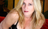 Anilos Jordan 23801 Curvy mature lady in sexy fishnet lingerie keeps her hands busy playing with her thick pussy lips