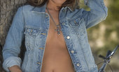 Penthouse Gina Austin Gina Austin stripping out of denim outfit outdoors
