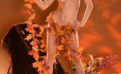 Penthouse Nevaeh 36452 Nevaeh is ready for the upcoming holiday season as she rolls around naked on a pile of autumn leaves and garlands.
