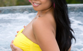 Penthouse Kya Tropic 37113 Kya Tropic playfully bobs up and down in the bubbling, soothing waters of an outdoor hot tub. As she gradually warms up she slowly pulls off her banana yellow bikini revealing her hot, curvy Asian body!
