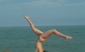 Met Art Selene A Live On Met by Met Cam Models 38474 Small model Selene on the beach as she removes her bikini.
