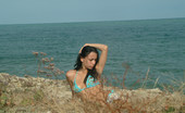 Met Art Selene A Live On Met by Met Cam Models 38474 Small model Selene on the beach as she removes her bikini.
