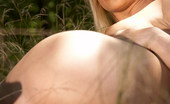 Met Art Angie A Presenting Angie by Tim Fox 38479 Country girl removes her clothes in the field only leaves her boots on.

