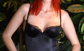 Met Art Marsha Lord Nadiques by Majoly 38531 Burning red head with a hot body shows off her black halter and stockings.
