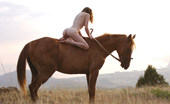 Met Art Dariya A Avans by Goncharov 38652 Riding in a strong horse is this brunette with kinky hair and alabaster skin.
