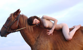 Met Art Dariya A Avans by Goncharov 38652 Riding in a strong horse is this brunette with kinky hair and alabaster skin.
