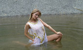 Met Art Julia AM Eubea by Anry V 38707 Nice breasts, big smile and big pond of water are all over this blonde.
