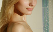 Met Art Katya AB Warmth by Voronin 38943 Sensual blonde with slim beautiful body enjoys a light shower.
