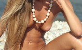 Met Art Volna A Sunshine by Alan Anar 39328 Surfer girl Volna exposes her lean and tanned body out at the beach.
