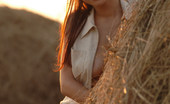Met Art Ksena A Presenting Ksena by Goncharov Ksena reveals her medium breasts on a haystack on this outdoor shoot.
