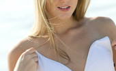 Met Art Jewel A Lisaxian by Emslie 39350 Long blonde haired beauty takes off her little white bikini and gets down and dirty in the sand.
