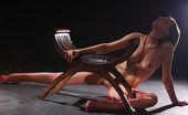 Met Art Enni A Presenting Enni by Goncharov 39458 New model Enni with her hard nipples gets friendly with red nets and a chair in this indoor shoot.
