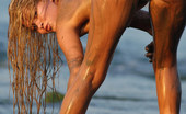Met Art Mira A Presenting Mira by Goncharov 39471 Long haired blonde gets down and dirty in the sand in the mud and sun.

