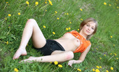 Met Art Elle B Fijiria by Volkov 39563 Elle gets flexible in a field of daisies revealing her soft curves.
