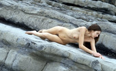 Met Art Alison A Scogliere by Cleghorn 39901 A soft pretty model lays out on hard gray stone.
