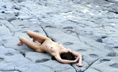 Met Art Alison A Scogliere by Cleghorn 39901 A soft pretty model lays out on hard gray stone.
