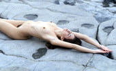 Met Art Alison A Scogliere by Cleghorn 39901 A soft pretty model lays out on hard gray stone.
