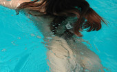 Met Art Sofia C Blu by Slastyonoff 39938 Long dark hair flows through water like a breeze as this pretty naked model swims.
