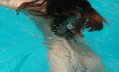 Met Art Sofia C Blu by Slastyonoff 39938 Long dark hair flows through water like a breeze as this pretty naked model swims.
