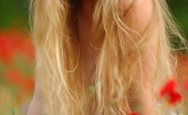 Met Art Vera E Tulipani by Goncharov 40229 Homely model eats organic foods and plays in the flowers naked.
