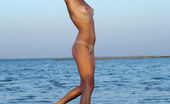 Met Art Lana F Floridis by Goncharov 40846 Blonde surfer girl with natural medium breasts and the cutest tan lines frame the best parts.
