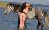 Met Art Olga K Riding by Goncharov 40921 Horses and naked girls going bare back and getting wet and a red asses.
