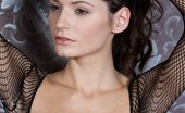 Met Art Leila A Recuerde by Rylsky 44022 Sultry brunette in revealing fishnet lingerie and naughty poses.
