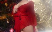 Met Art Jenya D Stolidi by Leonardo 44628 Jenya celebrates the holiday in a fiery red robe, sheer stockings and towering stiletto shoes.
