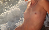 Met Art Daloria A Vasilema by Peter Guzman 45018 Daloria strips off her white bikini for a refreshing skinny dip by the beach.
