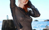 Met Art Natalia A Deos by Leonardo 45156 Naturally beautiful redhead with exquisite fair skin that matches her curly crimson mane, Natalia is an impressive display of ravishing, exotic beauty, naked in a rugged beach location.

