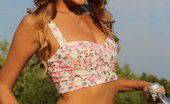 Met Art Mango A Calesma by Vlad Kleverov 45286 Fun, carefree and refreshingly cute, Mango exudes a pretty girl-next-door in her floral corset, skimpy pink skirt, and embellished sandals as she frolic on the grassy prairie with her bicycle.
