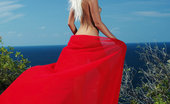 Met Art Adele B Dejanira by Tony Murano 45302 With a bright red scarf floating daintily along the wind, Adele exudes a breathtaking vision of radiant beauty and feminine gracefulness against the majestic blue sky.
