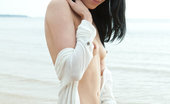 Met Art Lily J Receptivo by Koenart 45943 Lily loves outdoor photo shoots, especially on sandy seashores, savoring the cool, balmy wind that makes her breasts erect and stiff, and the cool, frothy water on her skin.
