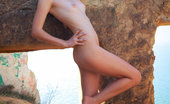 Met Art Nichole A Rispetto by Arkisi 46034 Nichole's soft allure and delicate, slender body nicely contrasts with the rugged terrain and rocky ruins.
