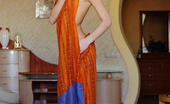 Met Art Katie A Dettaglio by Arkisi 46453 With just her orange flowing shawl to   cover her slender luscious body, Katie   makes a tempting presence in the living   room, posing without any hint of   inhibition.
