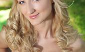 Met Art Zemira A Vaimne by Leonardo 46550 Enjoy a pleasing company in the outdoors   with Zemira, her blonde wavy hair   framing a seductive face and a hot   gorgeous body to boot stripping and   posing sensually in front of the camera.
