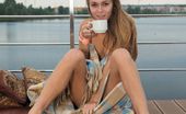 Met Art Katie A Matica by Alex Iskan 47013 Katie A sips on her coffee as she enjoys the cool, balmy air on her naked body.
