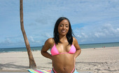 Round And Brown yani 59982 Hot beach babe shows off that fine ebony ass of hers in these pics
