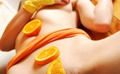  66311 Ariel Rebel plays with sticky oranges naked
