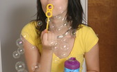  66435 Teen plays with bubbles
