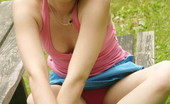  66446 Sexy teen sits at the park
