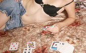  66452 Sexy teen model plays cards

