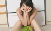  66458 Teen poses with a watermelon
