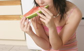  66458 Teen poses with a watermelon
