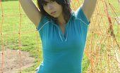  66474 Teen posing in soccerfield
