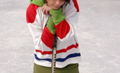  66483 Cute teen plays hockey

