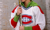 66483 Cute teen plays hockey
