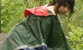  66495 Teen wears a raincoat
