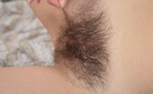 We Are Hairy Klea Klea bares it all on the bed 74388 Slender brunette Klea is full of energy and whats to stretch her long legs on the bed. She strips down to her sexy natural body and parades around her dark fluffy bush.
