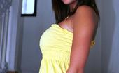  75754 Busty Nicole taking off her pretty yellow dress
